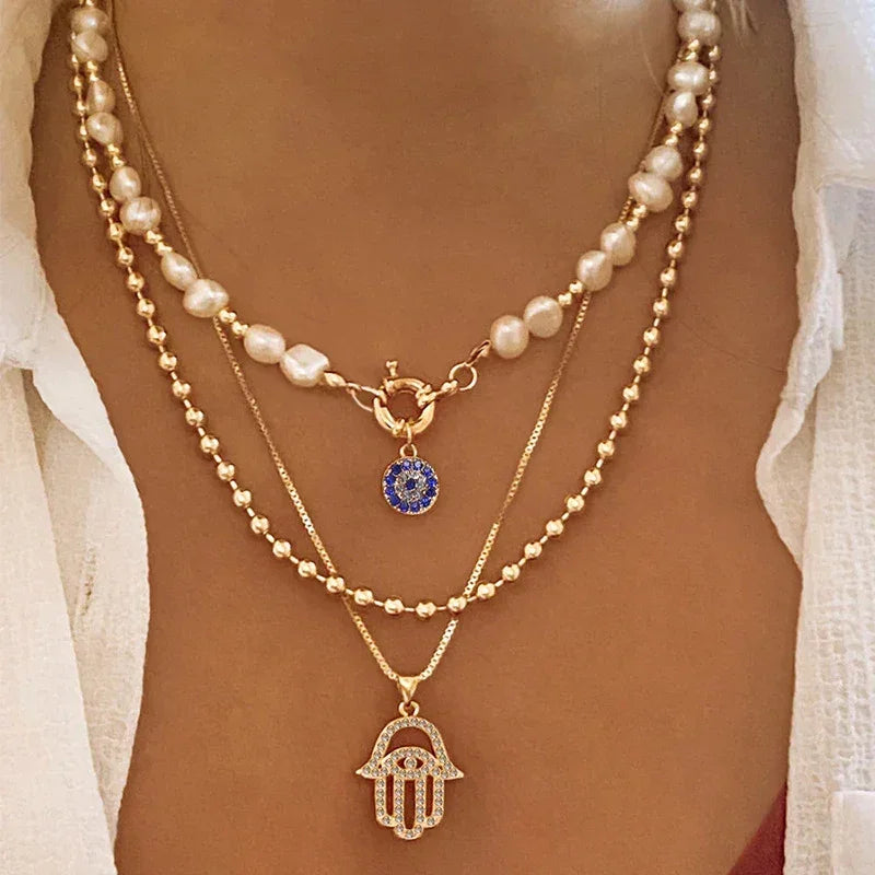 Colliers style bohème multirangs œil et croix - Colliers style bohème multirangs GoHappy