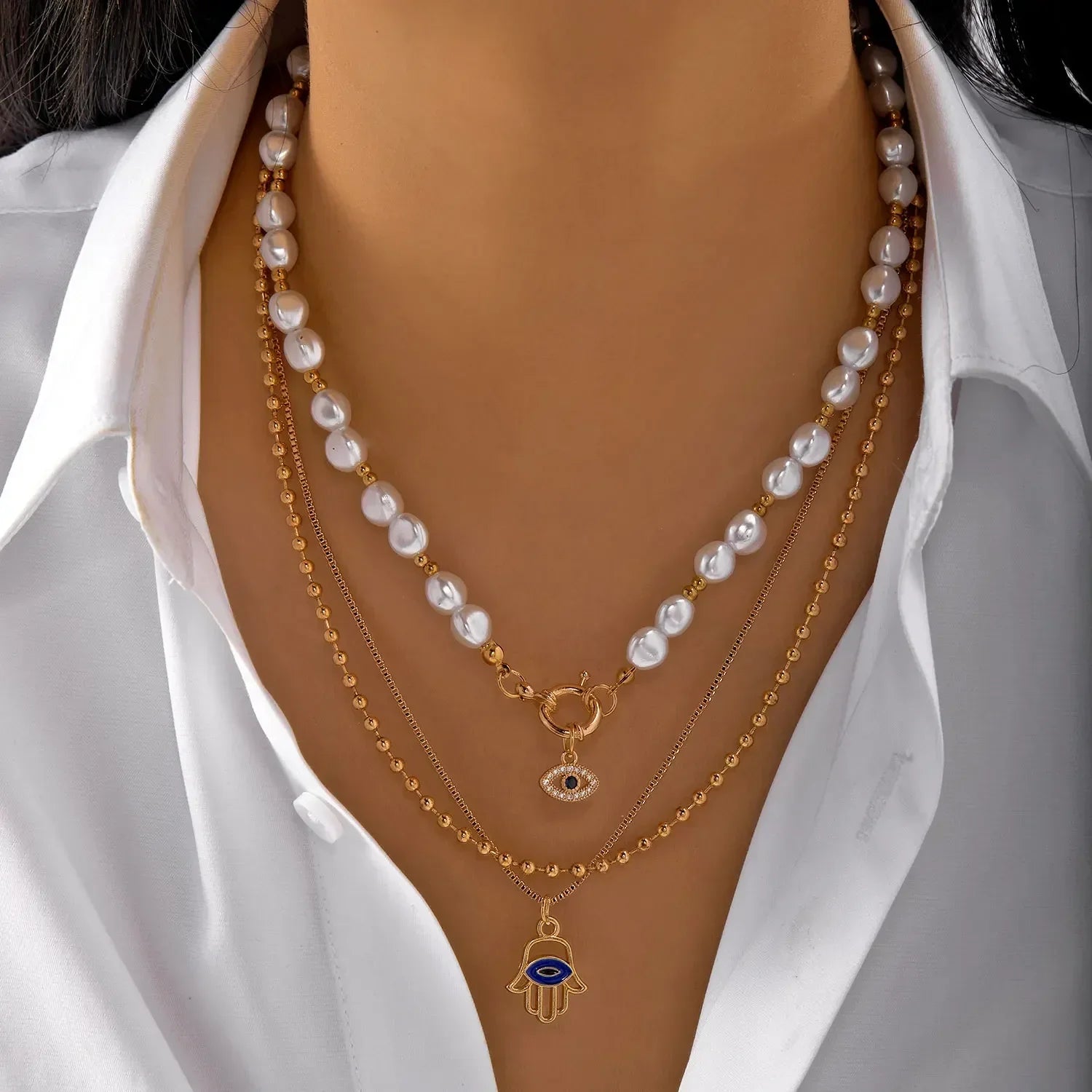 Colliers style bohème multirangs œil et croix - Colliers style bohème multirangs GoHappy