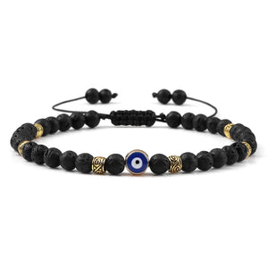 Bracelet Nazar Lave Noire dorée, perles fines et motif œil bleu | GoHappy France