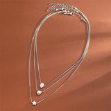 Colliers style bohème multirangs œil et croix