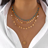 Colliers style bohème multirangs œil et croix