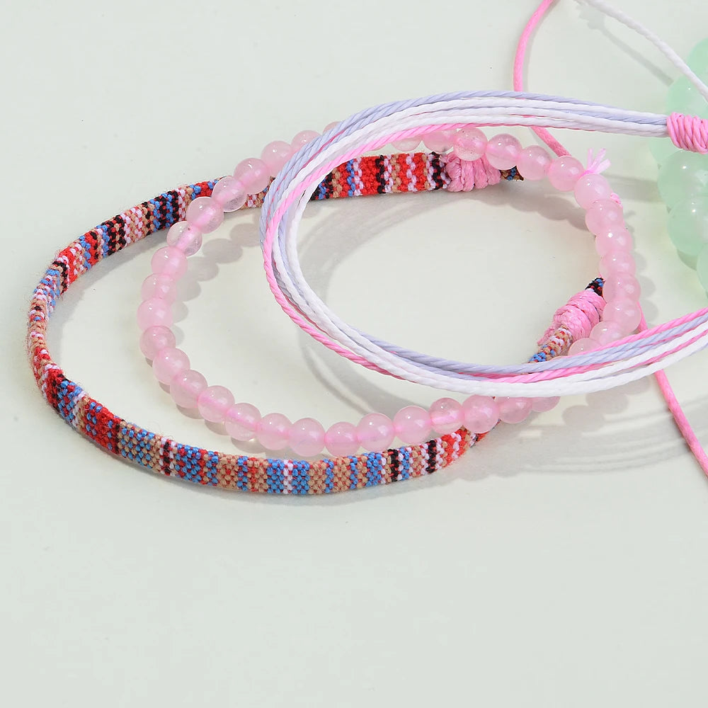 Nomad Trio Rose Pastel lot de trois bracelets tressés et perles