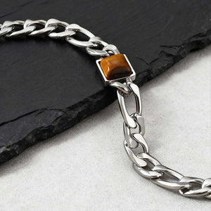 Gros plan de la pierre brune et dorée du bracelet Tiger Link